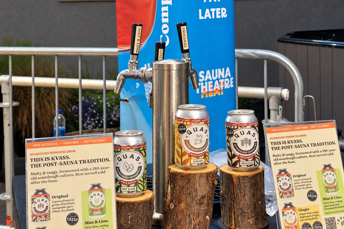 Quas taps and cans of Original, Ginger and Mint & Lime on log stands at the Sauna Theatre bar