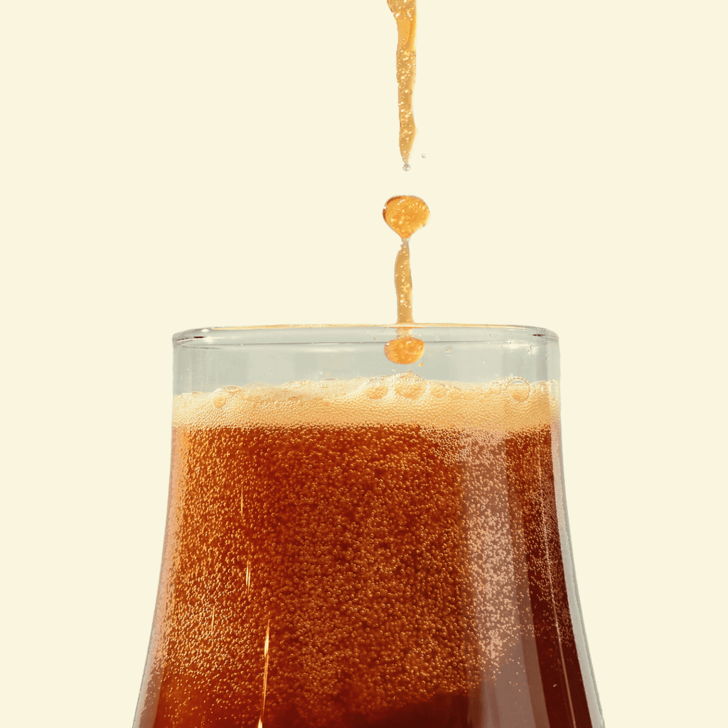 kvass being poured into a glass
